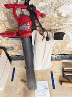 Full view of Toro blower/vac with attached collection bag and strap