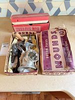 Both open boxes showing Universal and Keystone grinder parts and packaging