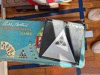 Risk and Tri-Ominos boxes showing wear