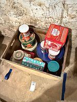 Overview of crate and tins, showing quantity and variety