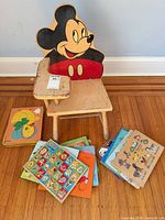 Front view chair and spread of puzzle boards on floor