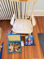 Wooden child rocker, blue case of animals, Mr. Bill figure grouped