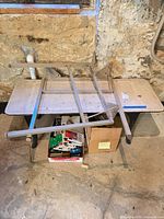 Overall view showing tabletop, two legs, and bracket frame