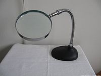 Magnifier showing glass lens, gooseneck and base