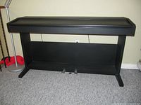 Front view of Kawai PN70 digital piano on stand showing full cabinet and two pedals