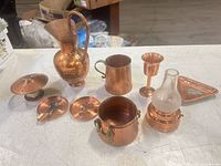 All nine copper items grouped on tabletop