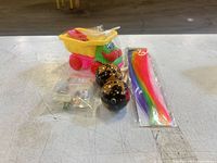 Group shot of dump truck, hair extension pack, wooden balls, accessory bag