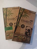 Front view of two sealed o brand bamboo toothbrush boxes