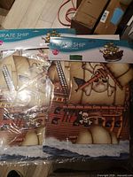 Front view showing two sealed packages of Beistle Pirate Ship cutouts