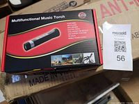 Front of retail box showing torch image and feature list