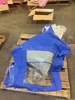 Poncho laid out showing blue body and clear window