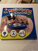 Front of sealed retail box showing Brain Game IQ & Treat Training Dog Puzzle Toys