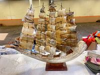 Overall view of capiz shell sailboat lamp on base