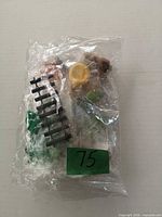 sealed bag containing topper set