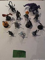 All 13 painted miniatures arranged on table