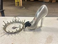 Overall lot view showing coin bank, tiara, purse hook