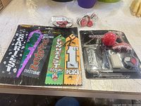 All items laid out: ribbon set, makeup kit, two packs pumpkin decorations