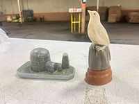 Both stone carvings showing size and relation