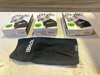 Front view of three boxed dog shirts and one unpacked shirt displaying slogans