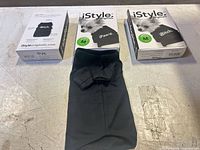 Front view of three boxed shirts and one unboxed shirt