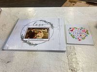 Both albums side by side showing relative sizes and covers