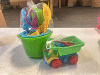 Bucket and dump truck in mesh packaging