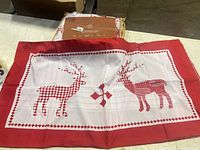 Duvet set pillow sham showing red reindeer silhouettes on white panel with red border