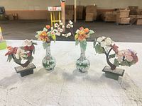 Front view of all four jade flower pieces