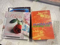 Stack showing Cherished Poems, Simply Baby under it, and Ecstasy Club