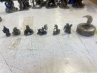 Row of six pewter fantasy figurines and moon trinket box