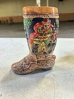 Right side view showing full boot shape and relief figures