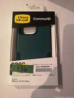 Front view of OtterBox Commuter Series case in retail box showing camera cut-out and color