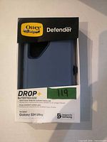 Front of boxed OtterBox Defender Series case showing product color and packaging