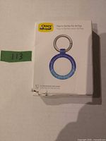 Front of OtterBox Figura Series AirTag holder box showing product image and color