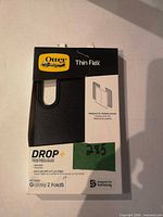 Front of retail package showing OtterBox Thin Flex case