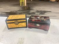 Both jewelry boxes front and lids visible