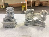 Both marble figurines side by side showing overall form