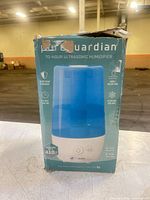 Front of box showing PureGuardian 70-Hour Ultrasonic Humidifier and product image