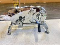 Front angled view showing overall slicer, crank handle and suction feet