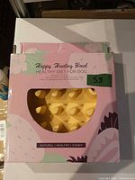 boxed Happy Hunting Bowl showing yellow slow feeder through window