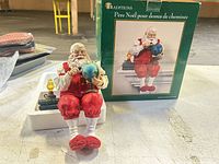 Figurine, styrofoam insert, box front