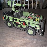 Left front view showing jeep body, cannon, decals and wheels
