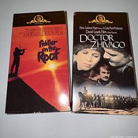 Front view of both VHS slipcases