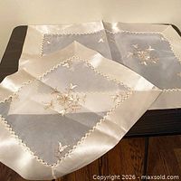 Both doilies displayed on table