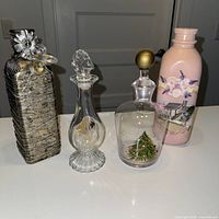 All four glass bottles grouped