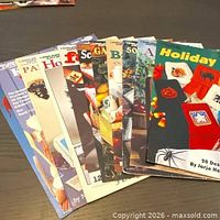 Fan layout of all 11 Leisure Arts pattern booklets