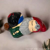 Left side view of sleeping gnome figurine