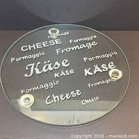 Top view of clear glass platter showing etched multilingual cheese words