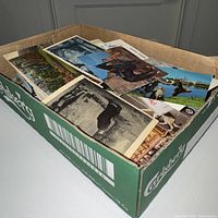 Full box showing quantity of postcards inside Carlsberg box