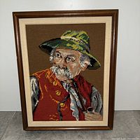 Full view of framed needlepoint artwork